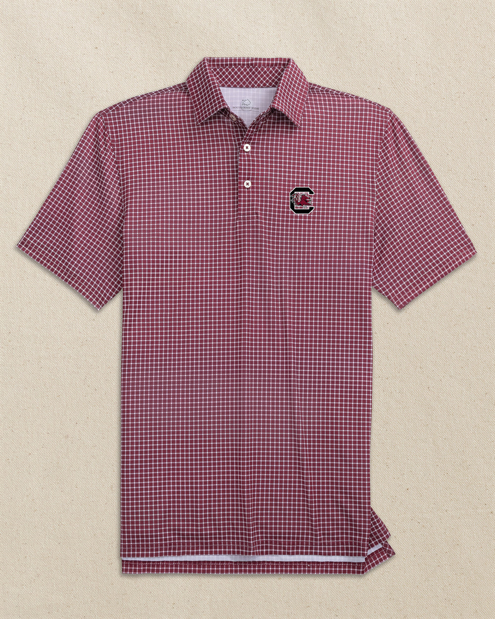 The front view of the Southern Tide USC Gamecocks Driver Dunes Edge Plaid Polo by Southern Tide - Chianti