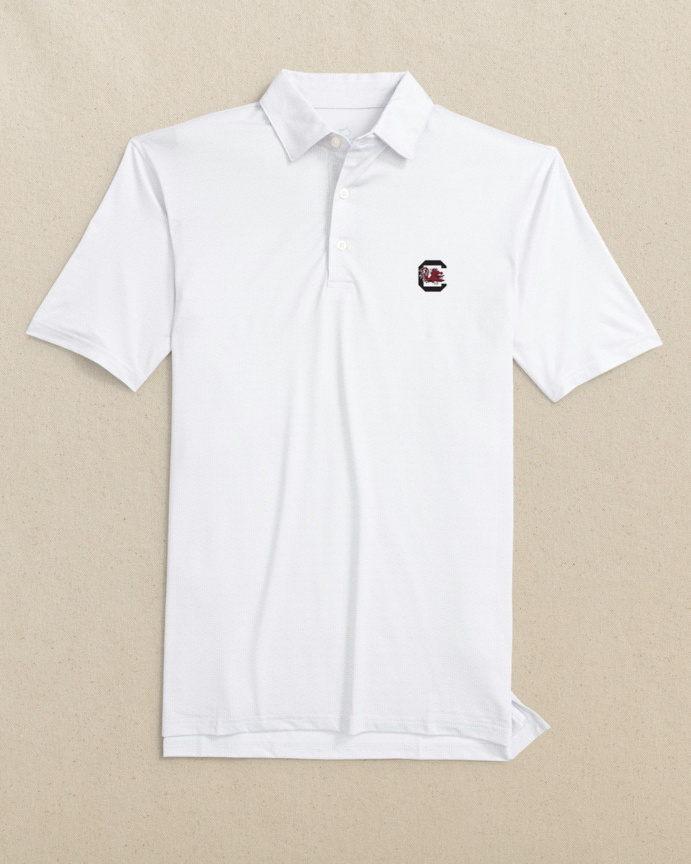 The front view of the Southern Tide USC Gamecocks Driver ST Geo Printed Polo by Southern Tide - Classic White