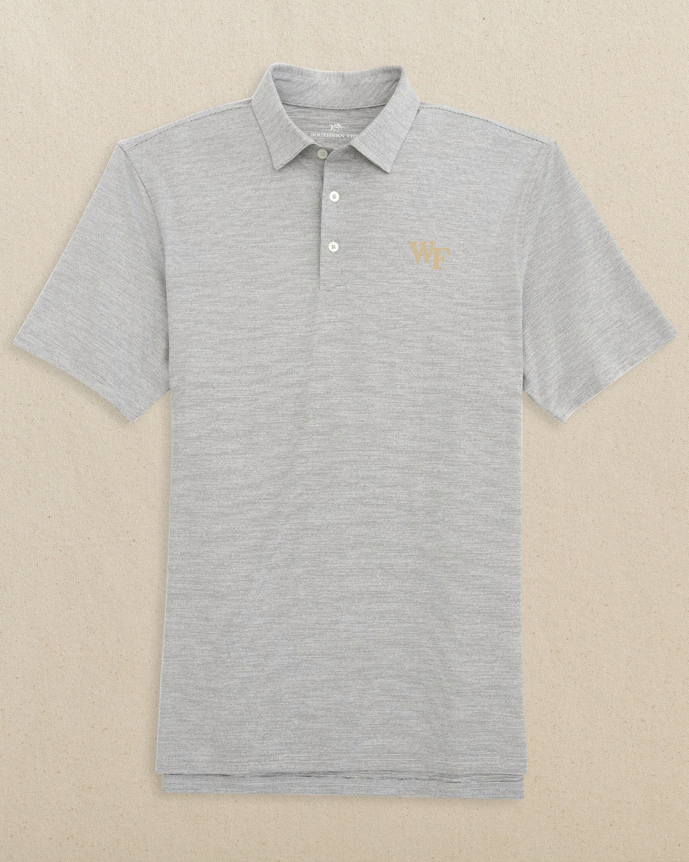 The front view of the Southern Tide Wake Forest Demon Deacons Gold Logo Driver Spacedye Polo by Southern Tide - Black