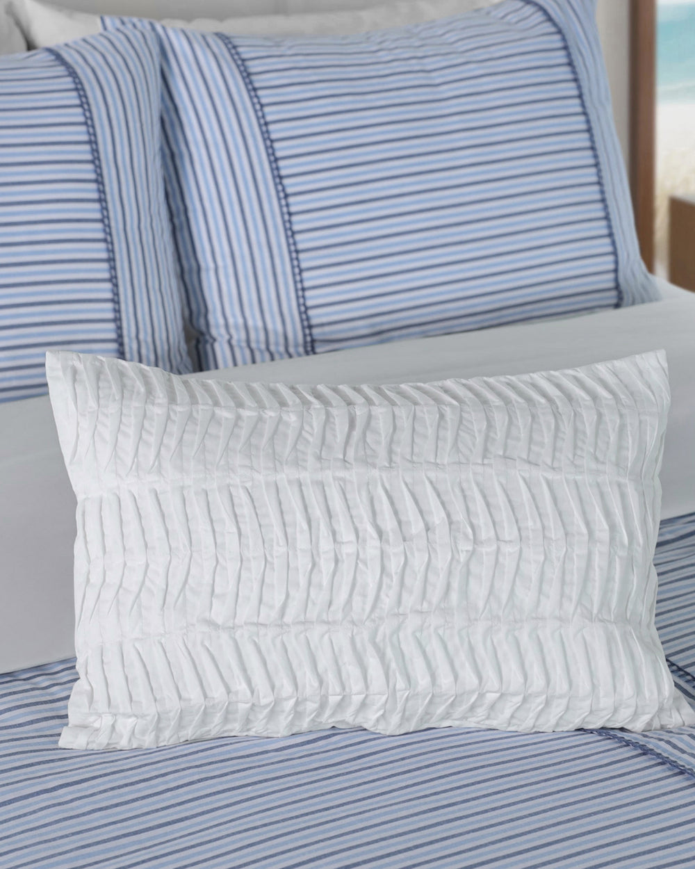 The detail view of the Southern Tide Waves Small Decorative Pillow by Southern Tide - White