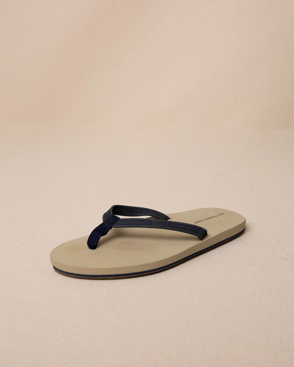 The front view of the Southern Tide Women's Weekend Navy Leather Flipjacks by Southern Tide - Nautical Navy