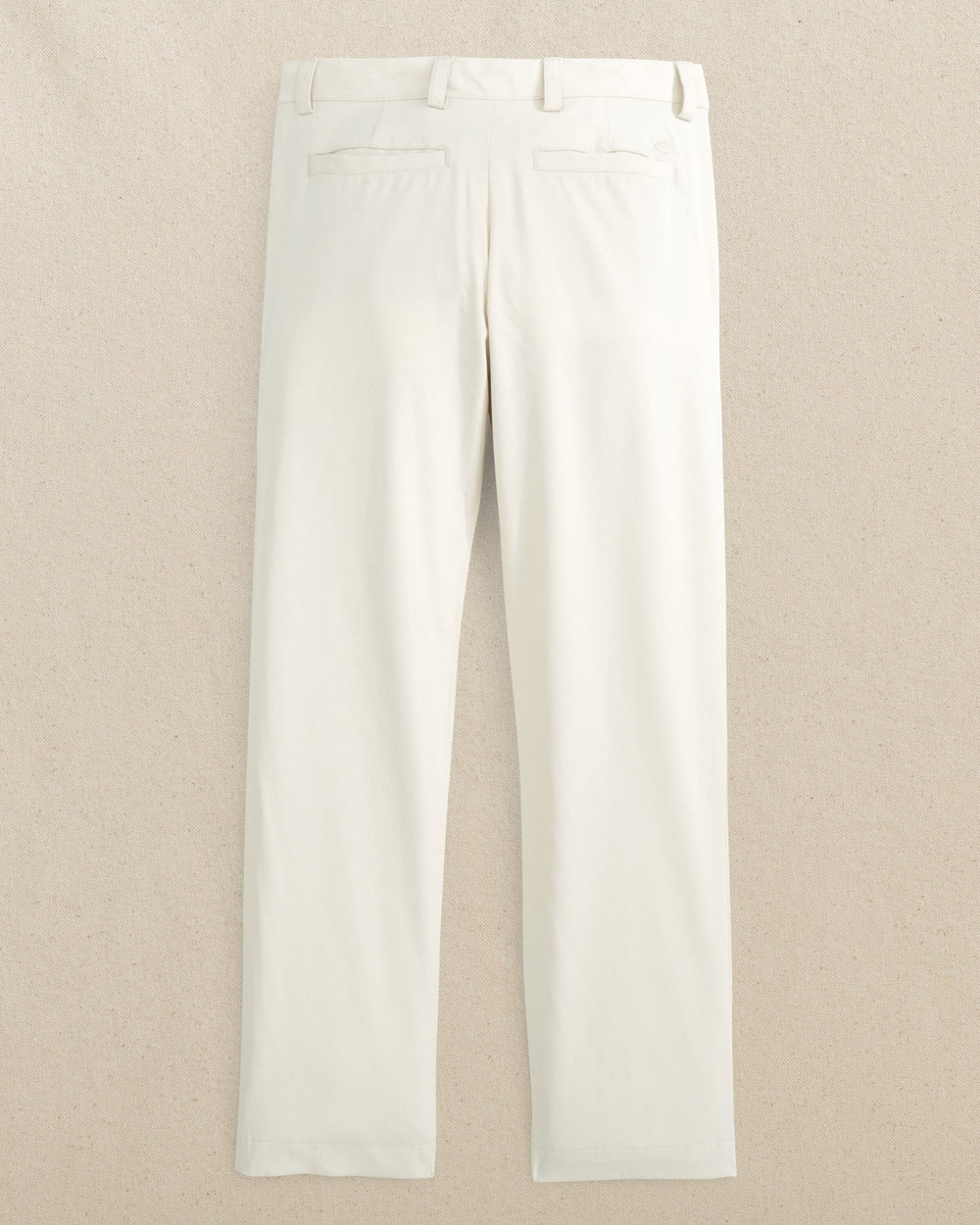 The back view of the Youth Leadhead Performance Pant by Southern Tide - Stone
