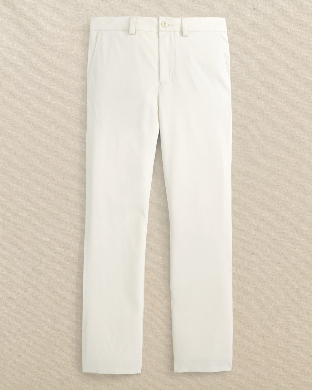 The front view of the Youth Leadhead Performance Pant by Southern Tide - Stone