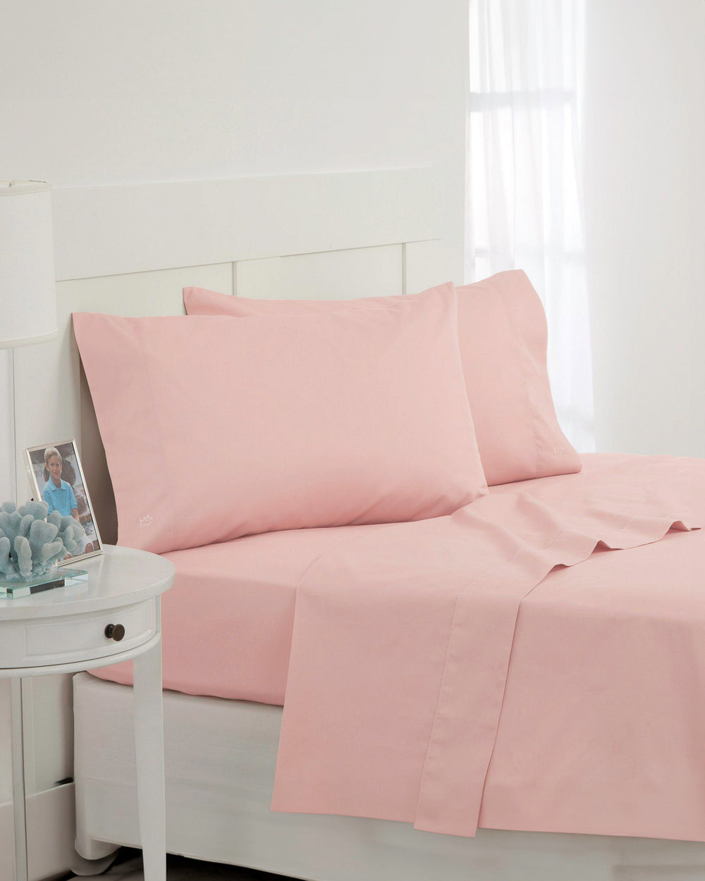 The angle front view of the Southern Tide Cotton Twill Sheet Set by Southern Tide - Seashell Pink