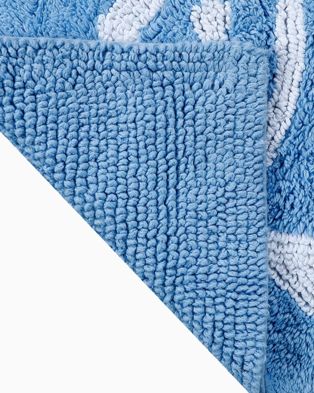 The flip view of the Reversible Skipjack Bath Rug by Southern Tide - Little Boy Blue